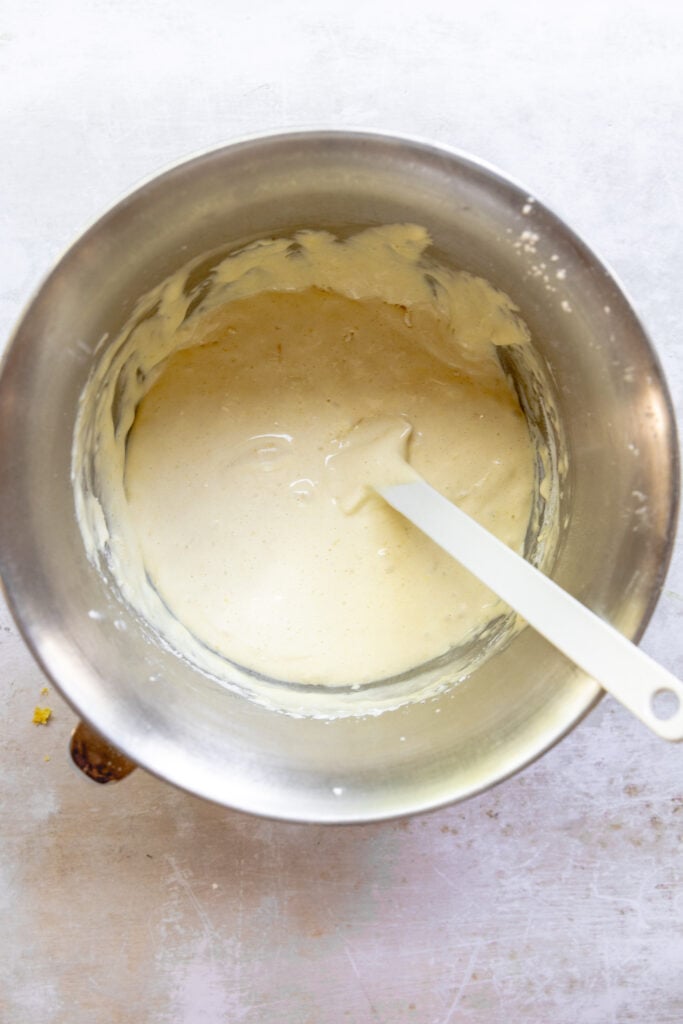 Eggs, Sugar, salt and lemon zest whipped in the bowl of a stand mixer folded with the dry ingredients for Lemon Sandkuchen.