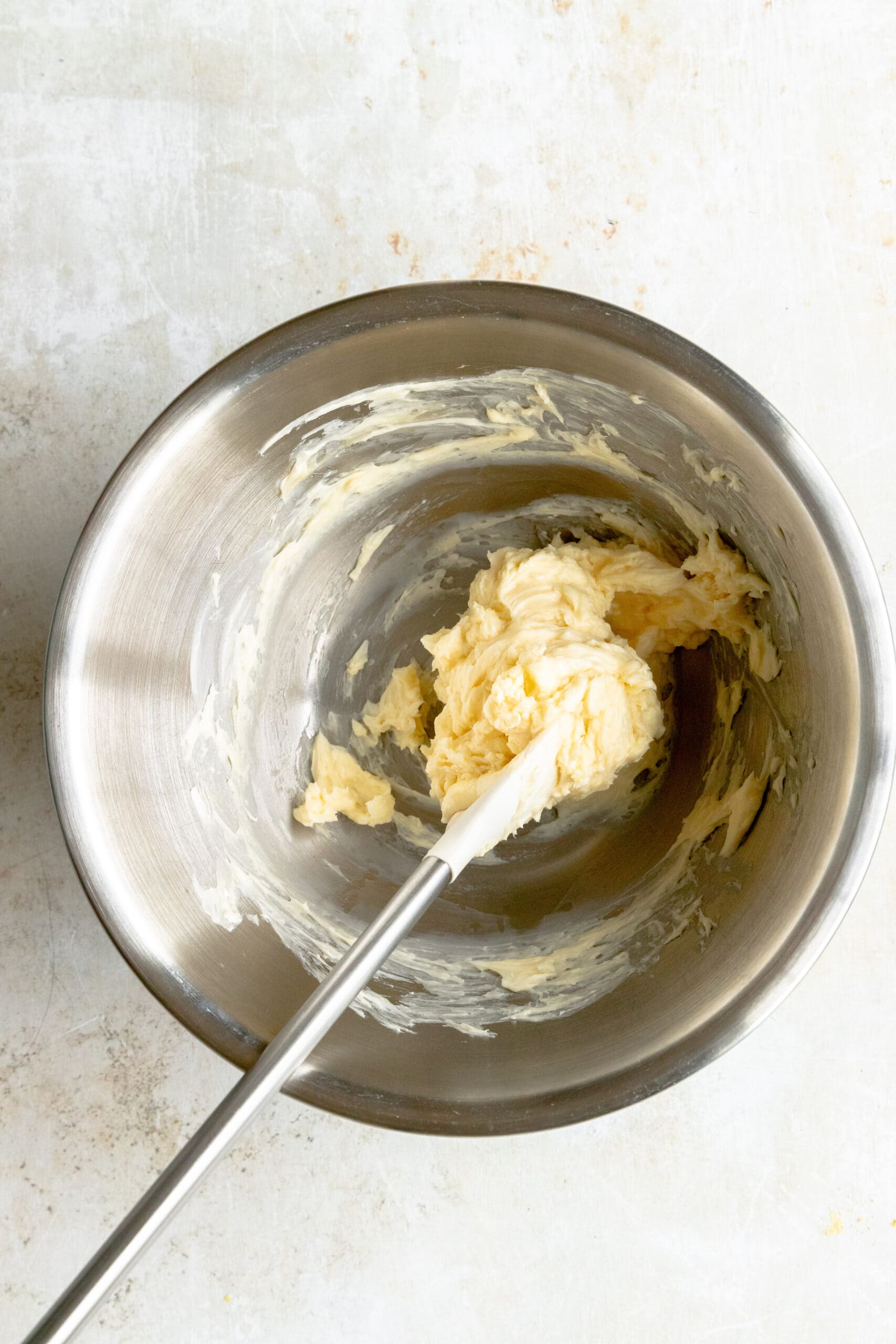 Mixing bowl with honey and butter mixed together.