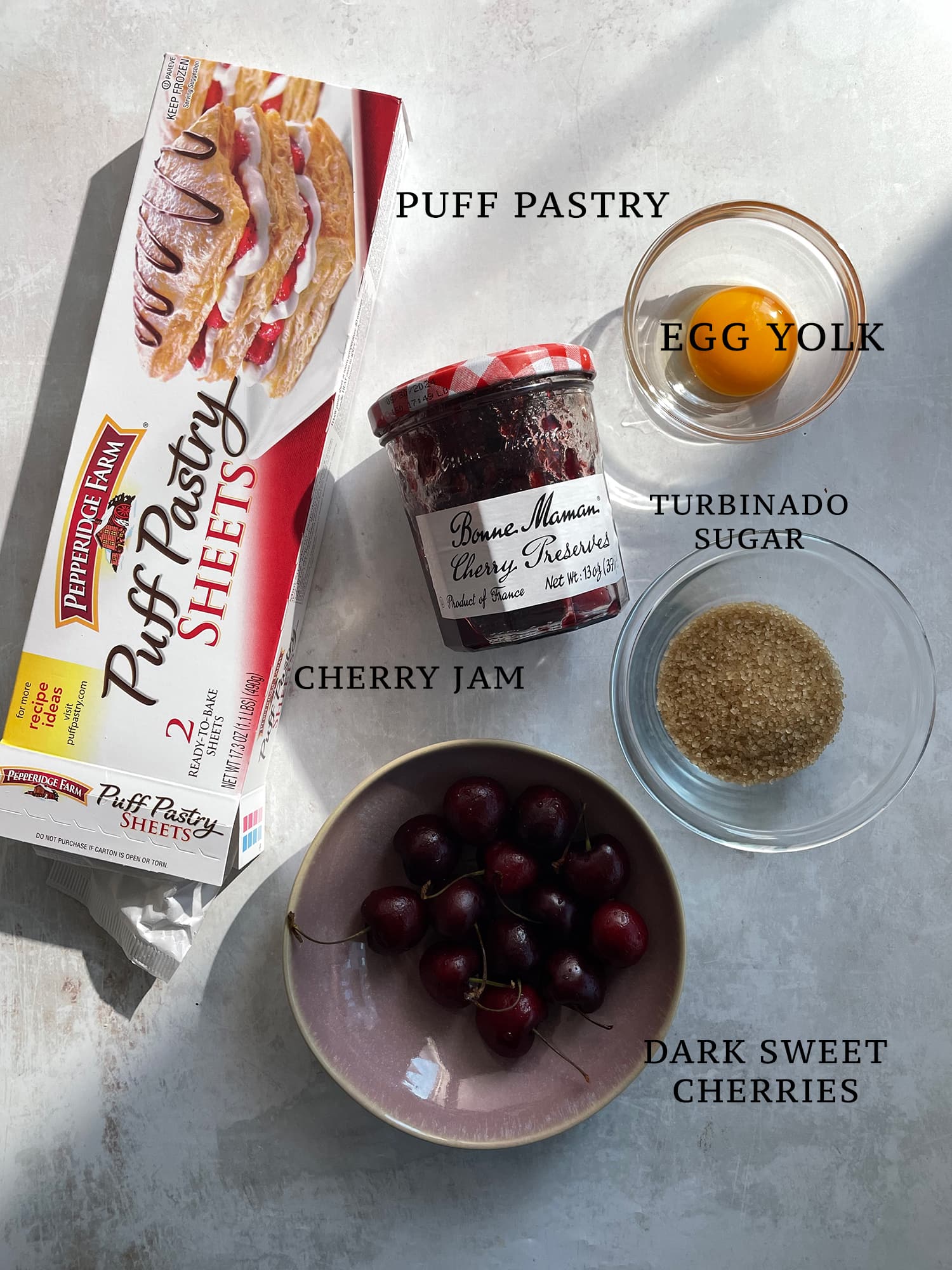 Ingredients needed for cherry hand pies with puff pastry. 