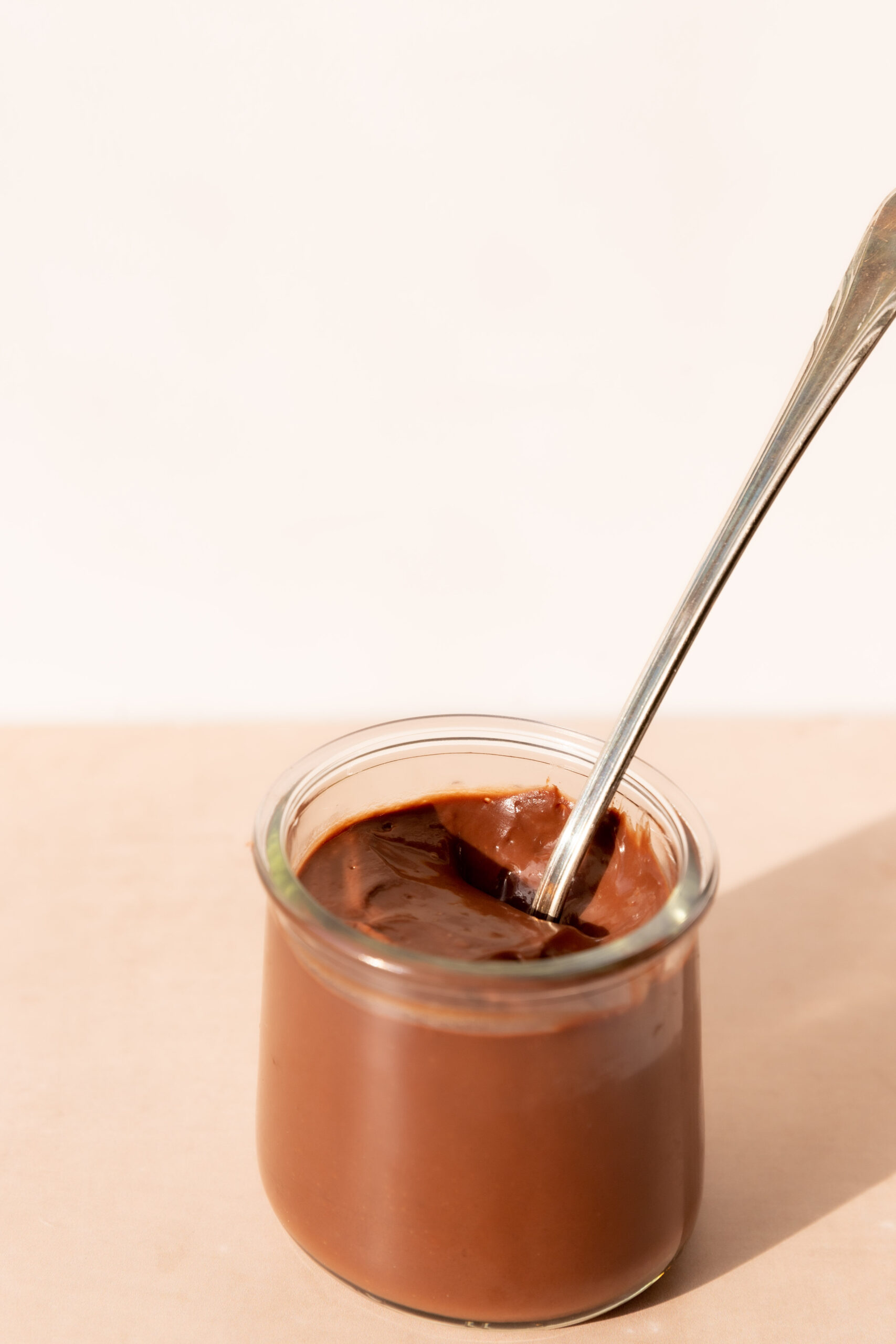 Little glass pot filled with the best chocolate pudding and a long thin spoon. 
