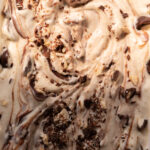 Overhead view of no churn hazelnut ice cream swirled with chocolate hazelnut spread.