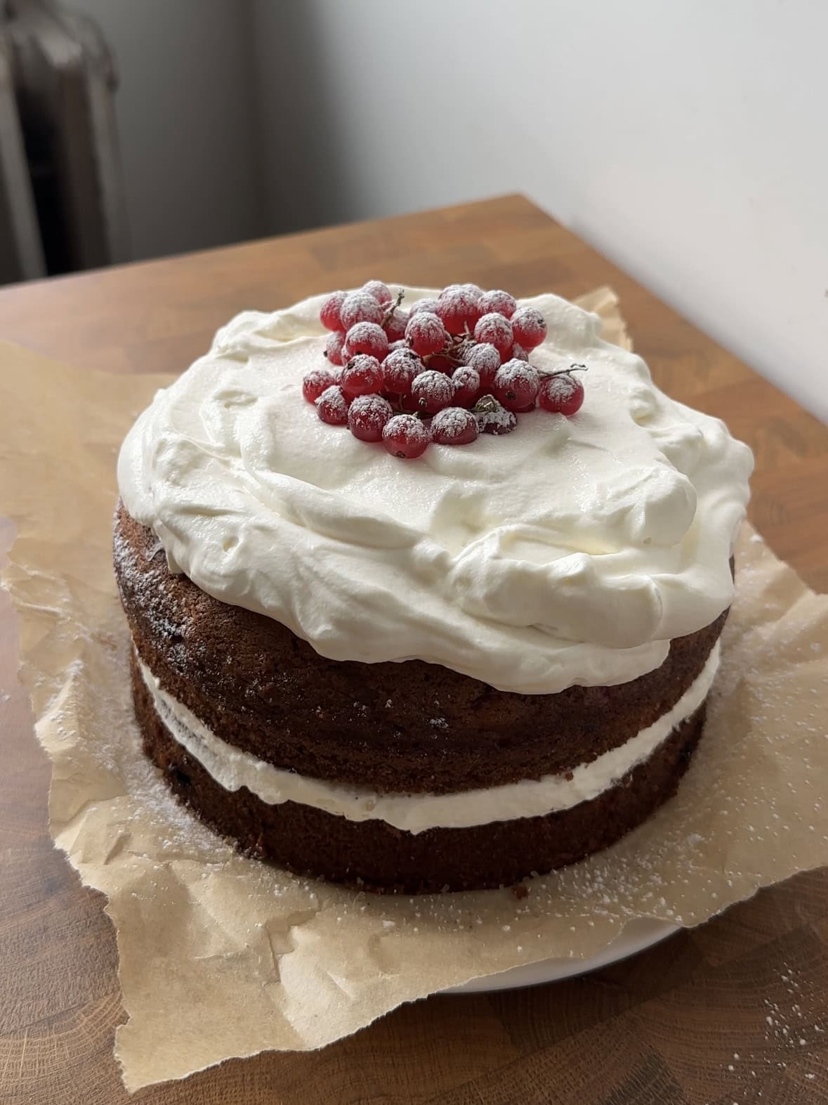 Full 7" red currant olive oil cake with sour cream whipped cream.