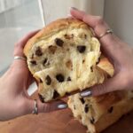 Side view of a thick portion of a Chocolate Chip Brioche loaf.