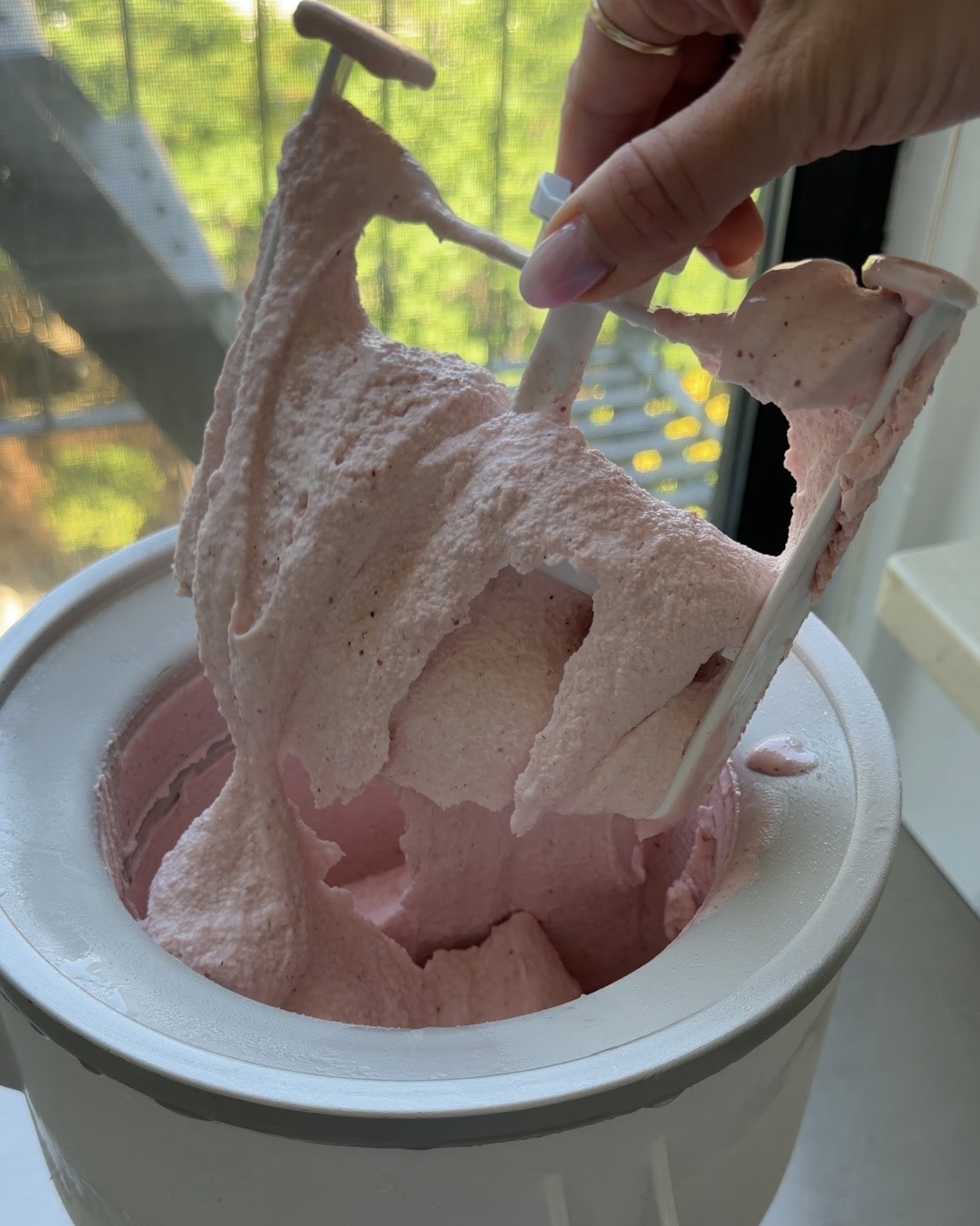 Strawberry Ice cream freshly churned in a kitchen aid ice cream bowl.