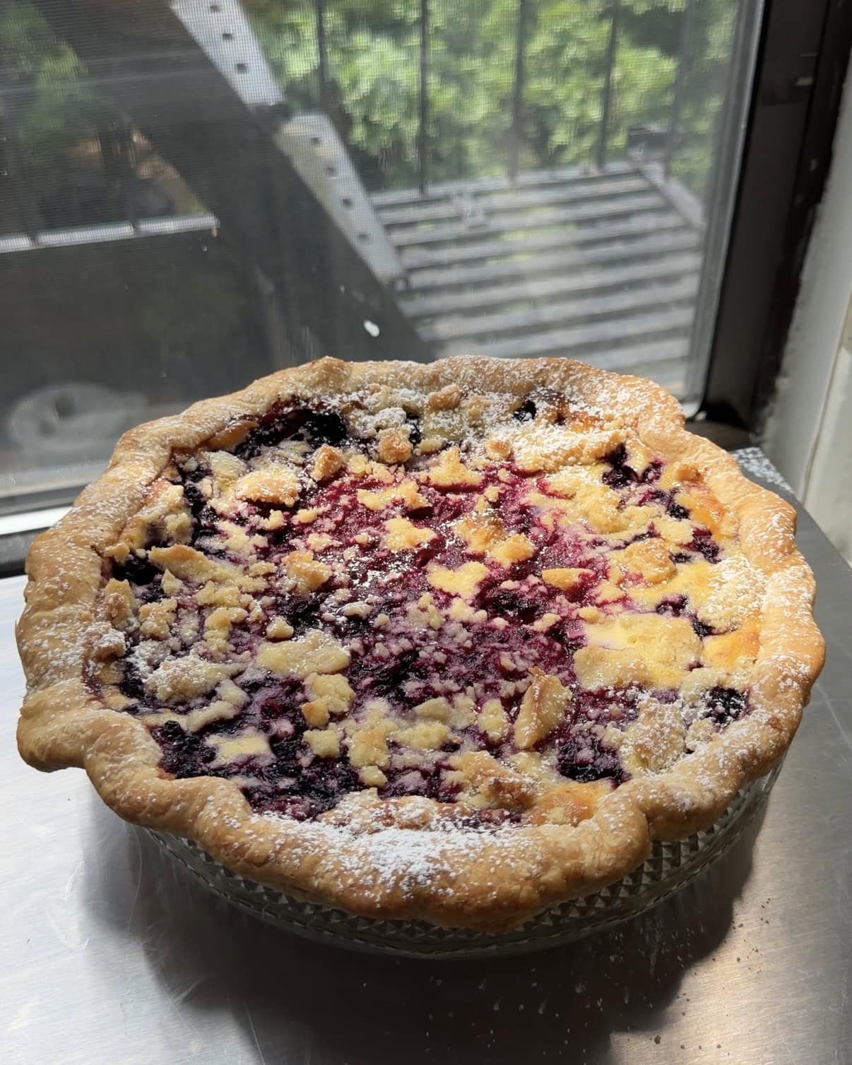Side view of a Lemon Blueberry Cheesecake Pie.