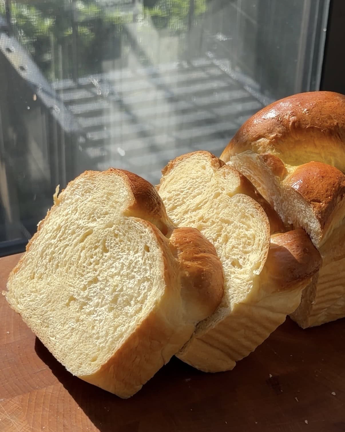 Side view of slices of fluffy Classic Brioche Loaf.