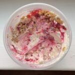 Overhead view of a pint container of Red Currant Crisp Ice Cream.