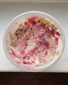Overhead view of a pint container of Red Currant Crisp Ice Cream.