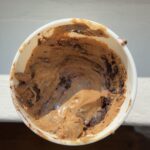 Overhead view of a Coffee Oreo Fudge Ice Cream in a quart container.