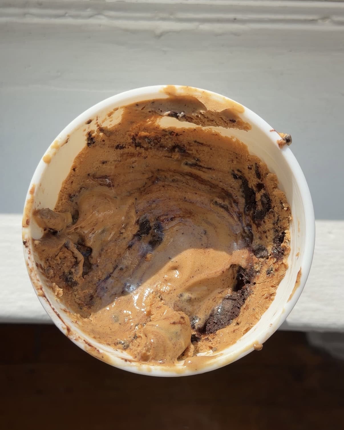 Overhead view of a Coffee Oreo Fudge Ice Cream in a quart container.