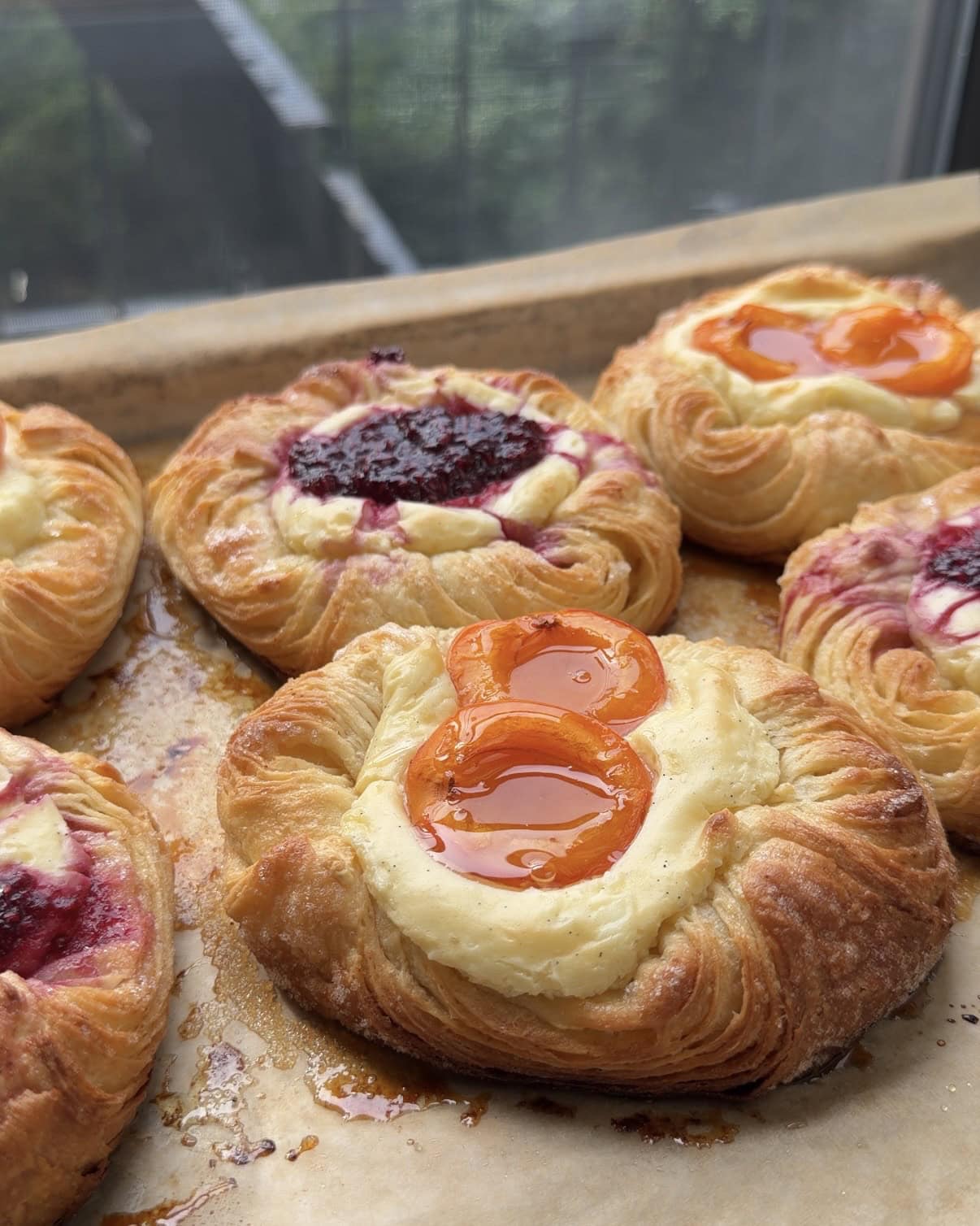 Side view of an apricot cream cheese danish.