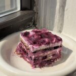 Side view of a slice of Lemon Blueberry Icebox Cake one a white plate.