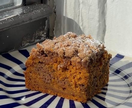 Side view of a slice of Brown Sugar Pumpkin Coffee Cake.